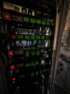 Communications room power distribution units and extension leads tested and labelled during PAT Testing inspection.