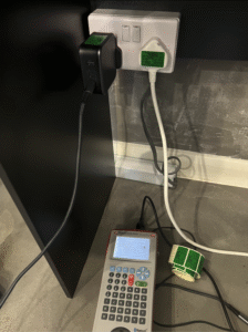 Seaward PAT tester connected to appliance during electrical safety testing.